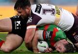 Rabbitohs' Cameron Murray, who is eyeing State of Origin action, is tackled by Tyson Smoothy. (Dan Himbrechts/AAP PHOTOS)