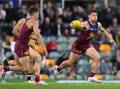 Gun midfielder Lachie Neale (R) delivered 20 disposals and seven clearances for the Lions. (Darren England/AAP PHOTOS)