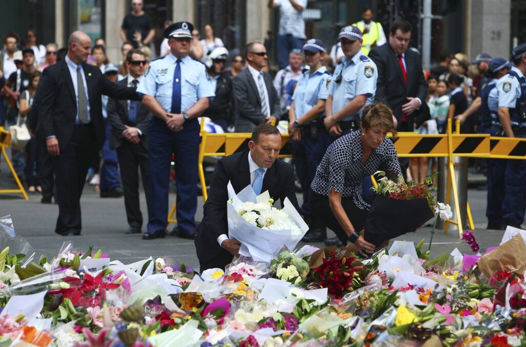 Martin Place siege ends after police storm Lindt Cafe, shots fired, two ...