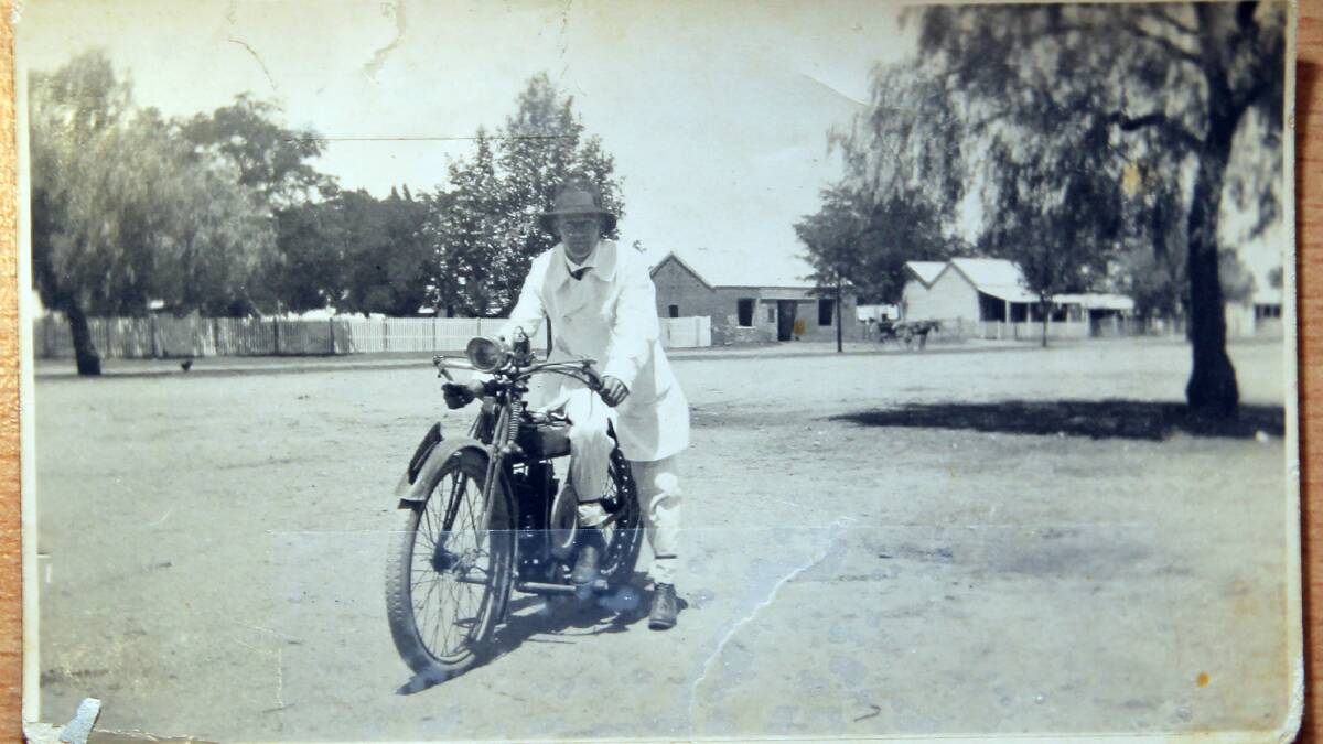 Vic Culph with his motorbike used during his rounds as an AMP agent.