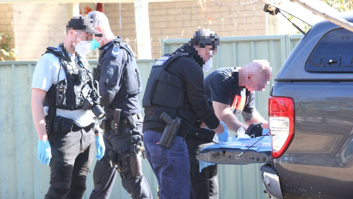 Police search a Hibbett Crescent home in Wodonga on Tuesday. 