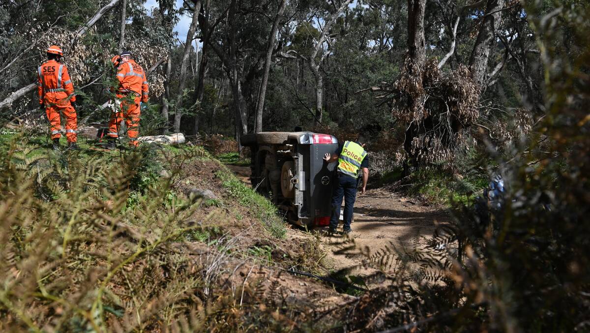 CRASH SCENE: Police and SES volunteers at the site on Sunday. 