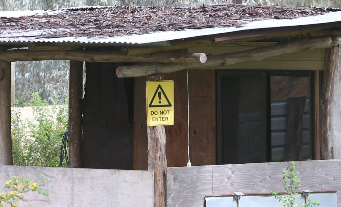 People are warned to keep away from the property. 