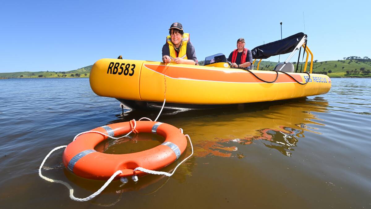 TRAINING: SES volunteers Mel Murray and Warrick Armstrong with the new vessel on Lake Hume at Tallangatta on Saturday. Pictures: MARK JESSER