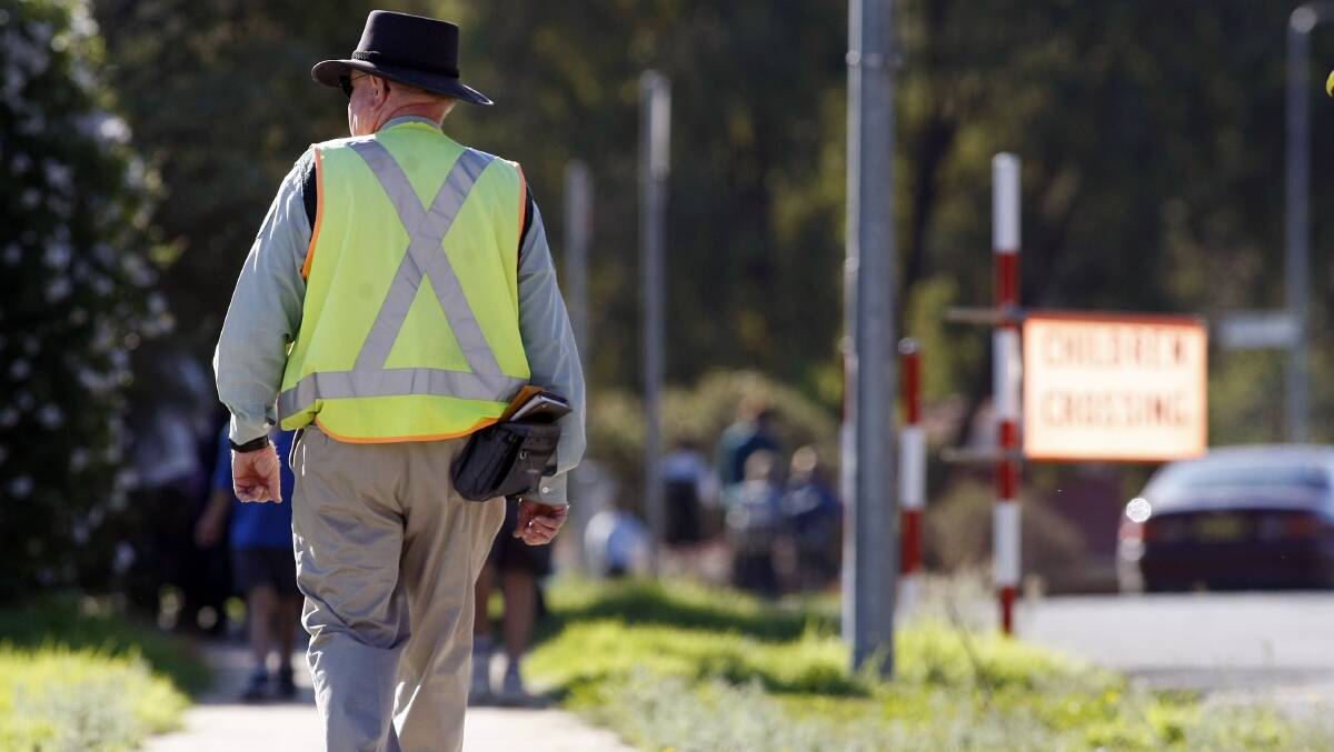 FINES: A file photo of a parking inspector outside Thurgoona Public School. 