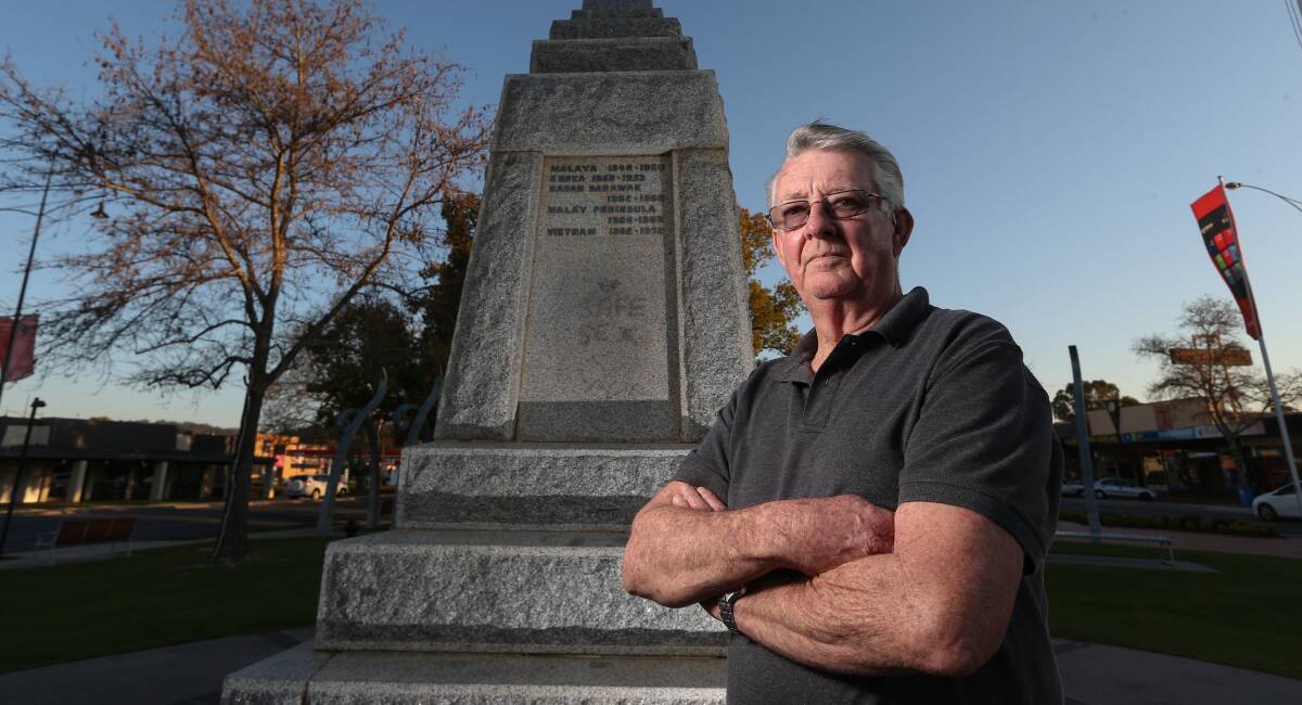 ANNOYED: Kevyn Williams at the damaged cenotaph in Wodonga. 