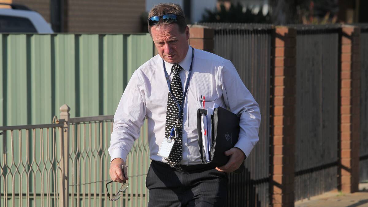 INVESTIGATOR: Paul Tremain arrives at the home on Sunday. Police are yet to interview the suspect. Picture: BLAIR THOMSON