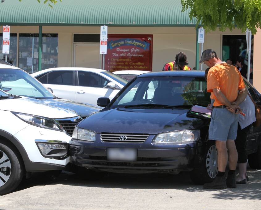 COSTLY: Three cars were damaged when a Toyota driver lost control and hit two other vehicles while parking in Wodonga. No one was injured during the crash despite initial concerns from paramedics. Picture: BLAIR THOMSON