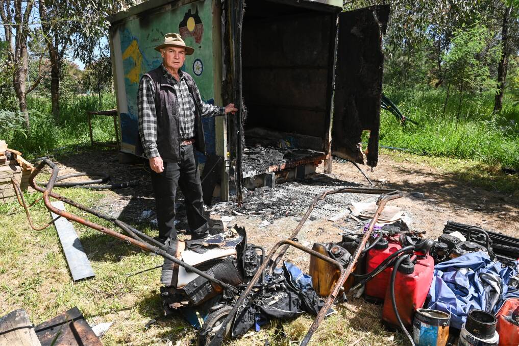 Landcare volunteer Tony Lane with the burnt out container in Wangaratta. Picture by Mark Jesser