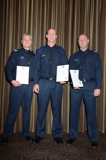 RECOGNITION: Sergeant Mal Clarke, Constable Ben Ryan and Senior Constable Travis Aylmore with their awards. 