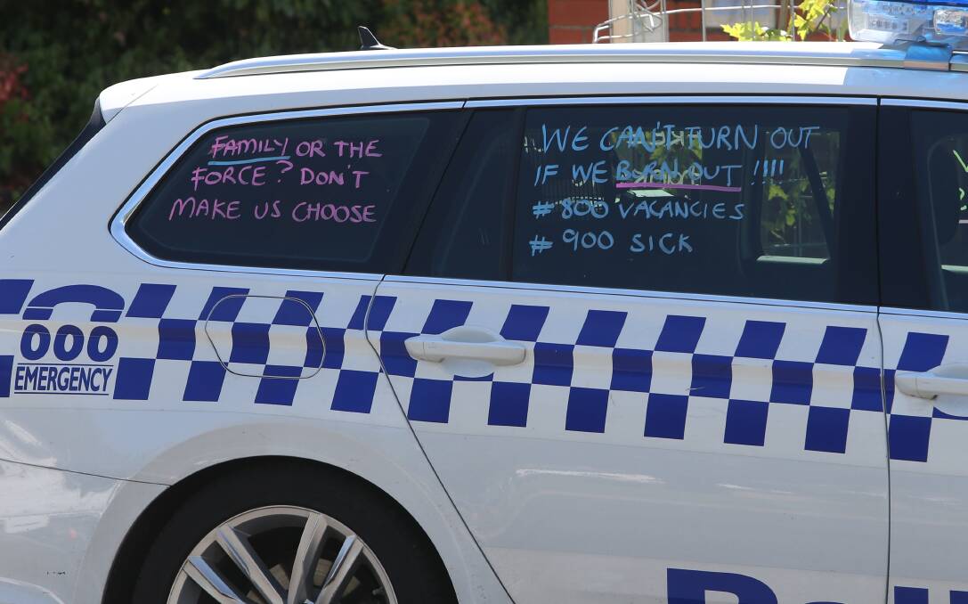 Messages written on a Wodonga police vehicle in December 2023 amid concerns over severe staffing shortages. File photo