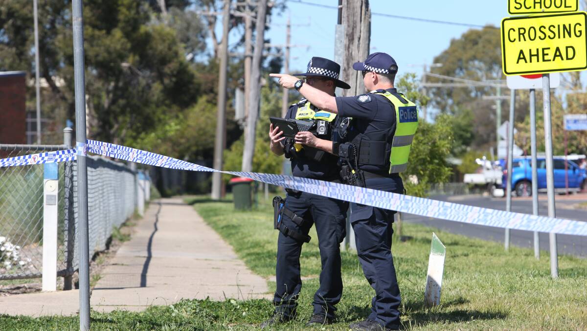 Police at the scene of Friday morning's stabbing on White Street in Wangaratta. Picture by Blair Thomson