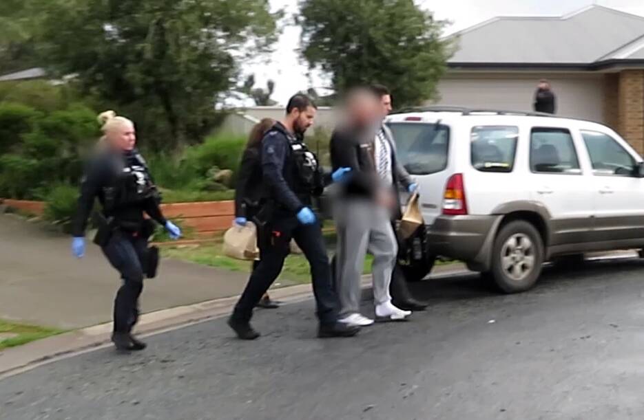 Searby is arrested by police at his Barnawartha home. Picture by Victoria Police 