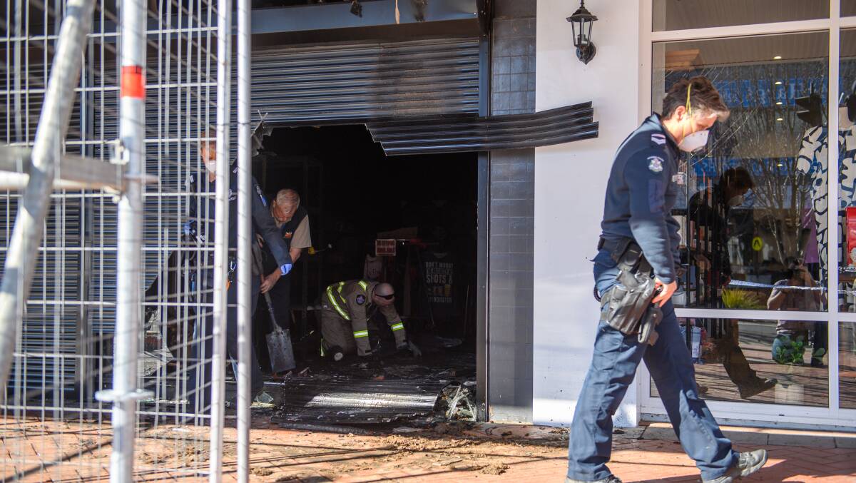 Police investigate the fire at a High Street business in Wodonga in July. Picture by Mark Jesser