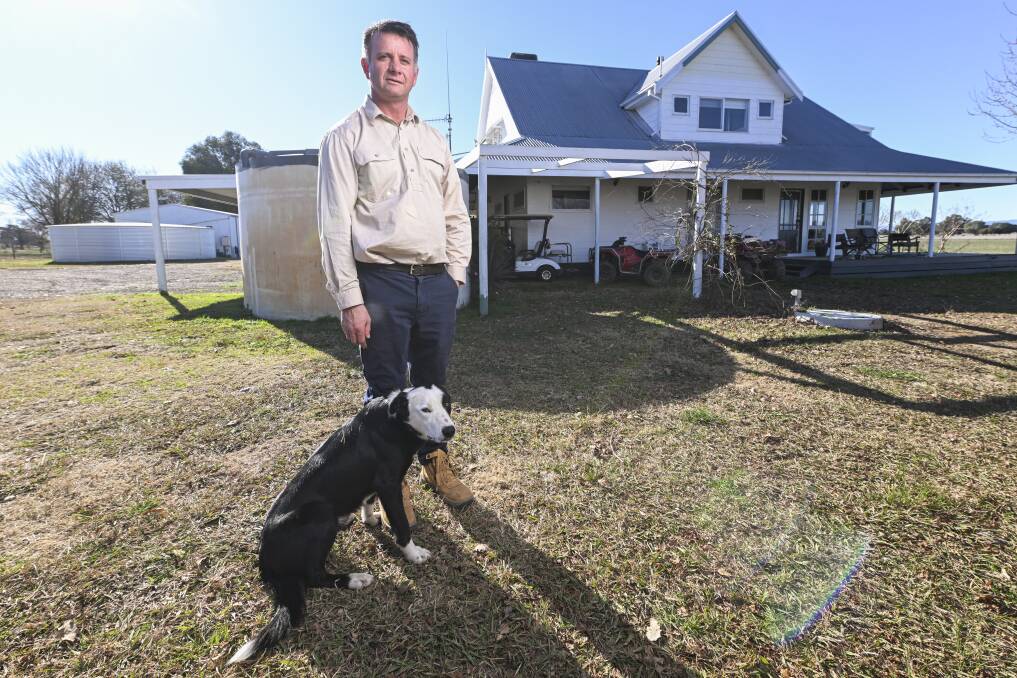 Moyhu farmer Mark Hodge, pictured with his dog Doc, was sleeping in his home with his family when a straight bullet shot through his roof. Picture by Mark Jesser