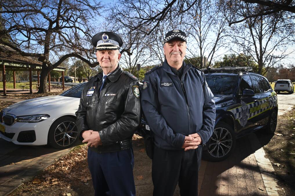 NSW Assistant Commissioner Brett McFadden and Victorian Assistant Commissioner Glenn Weir at the official launch of their road safety operations on the Hume Highway in Albury on Tuesday. Picture by Mark Jesser