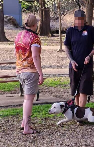 An image of the dog and its owner at Les Stone Park on Monday afternoon. 