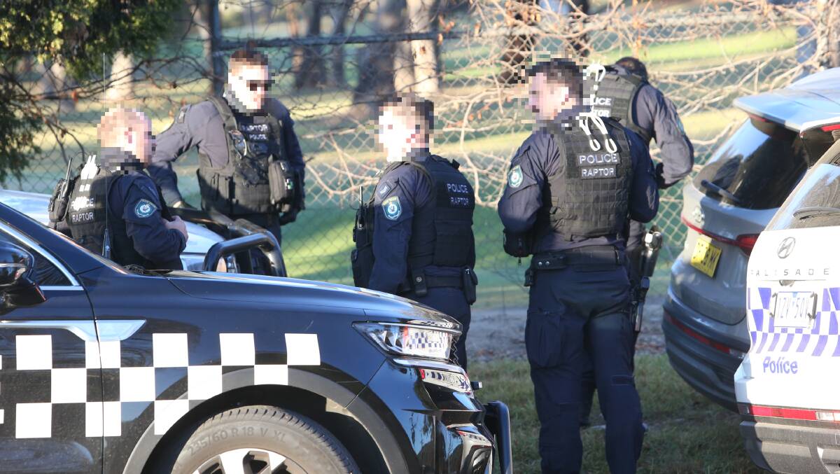 Members of the NSW Raptor Squad on Ryan Road in Albury on Wednesday ahead of a search warrant. 