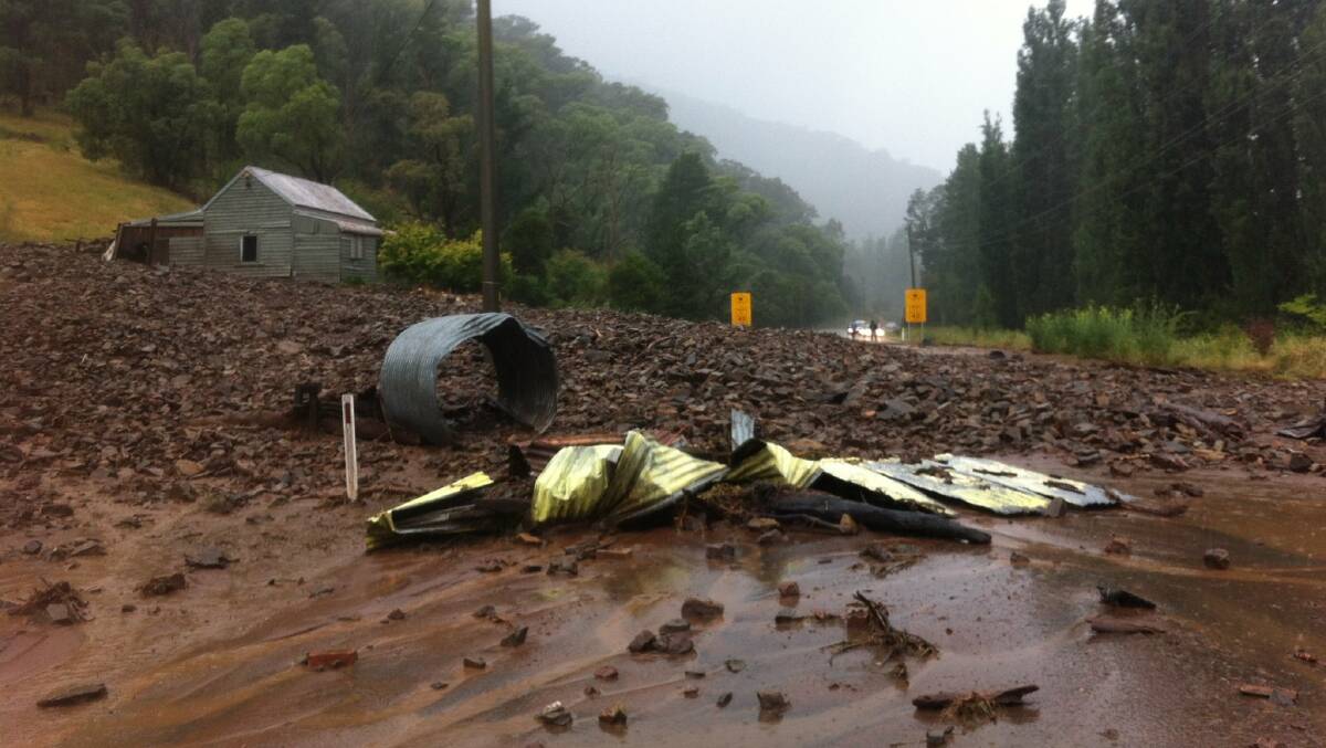 DAMAGE: The aftermath of the rain on the Great Alpine Road at Ovens on Tuesday afternoon. Picture: VICTORIA SES