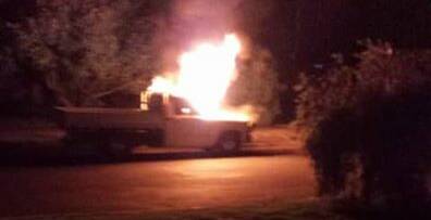 SET ALIGHT: Reader Mark Fabris submitted this photo of the Ford ute on fire in London Road on Wednesday morning.