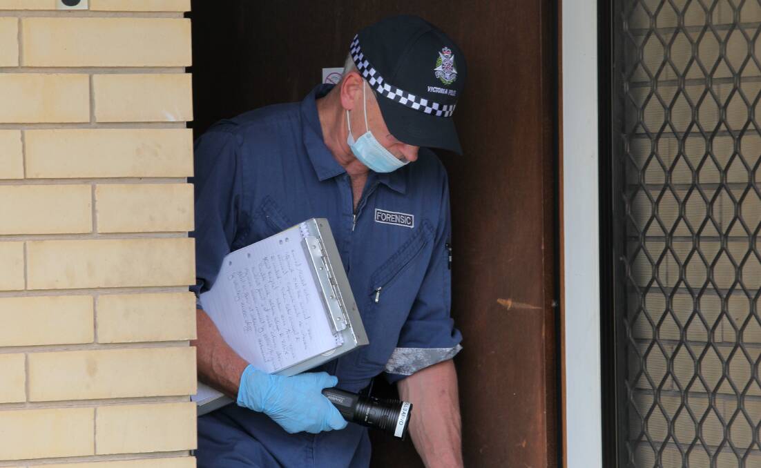 CRIME SCENE: A forensic officer at the unit. Picture: BLAIR THOMSON