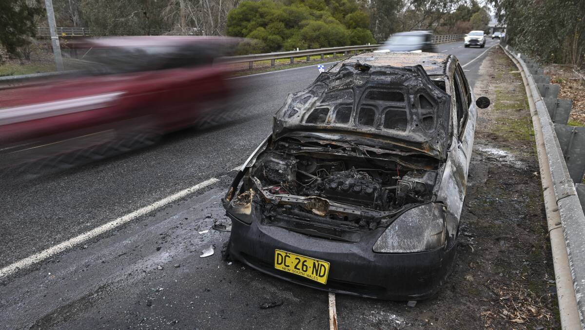 Wodonga police are also investigating this car fire on the Lincoln Causeway on Saturday morning. Picture by Mark Jesser
