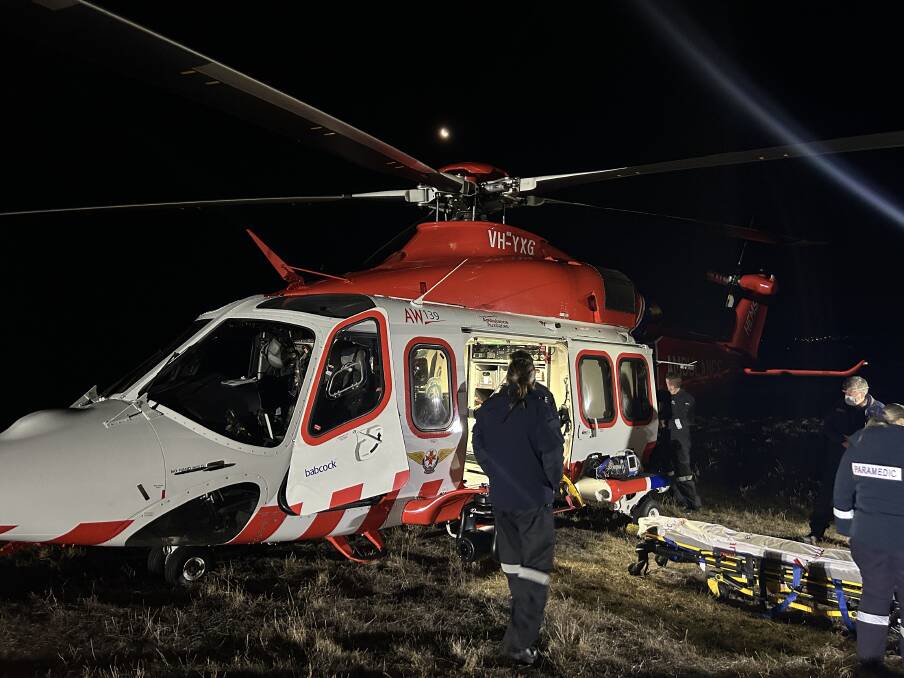 Air ambulance crews prepare to fly the injured Tangambalanga motorbike rider to Melbourne after Monday afternoon's crash at Leneva. Picture supplied