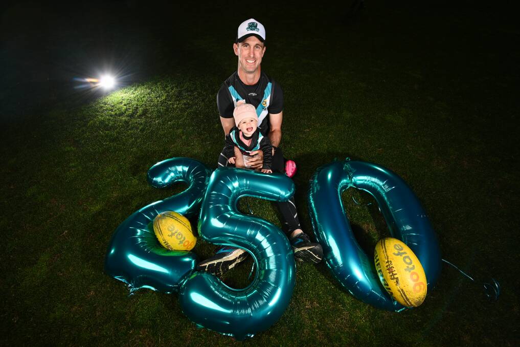 Luke Garland and daughter Bronte, 18 months, ahead of his 250th game for the Panthers. Picture by Mark Jesser
