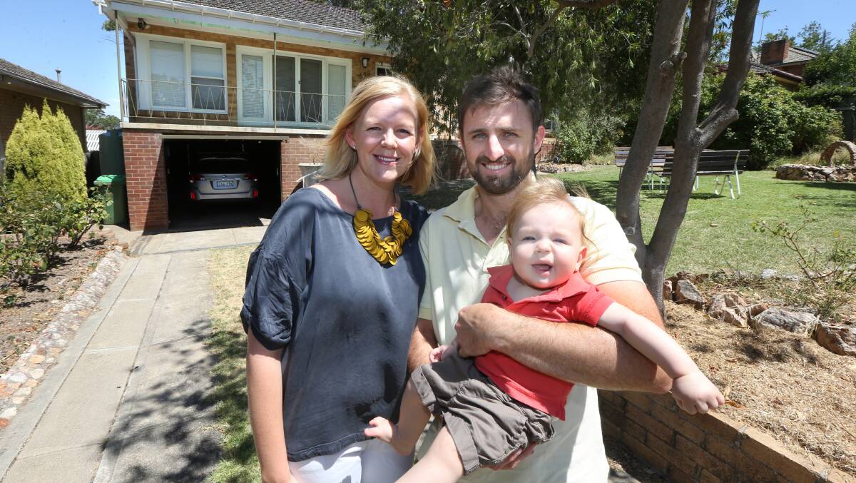 HAPPY FAMILY: Gemma and Josh Broad at their Forrest Hill home with son Beau not long after they moved to Albury. They have no regrets about getting out of Sydney three years ago. 