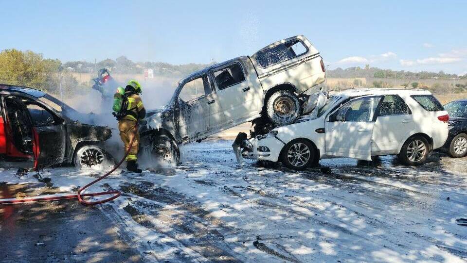 Firefighters at the scene of the Young Street pile-up on March 24. A woman suspected of causing the crash remains in hospital. Picture supplied