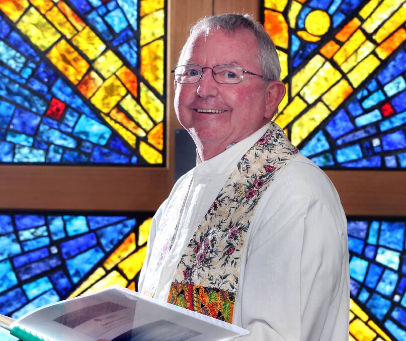 Good spirits: Wodonga parish priest Father Dennis Crameri says Christmas is a wonderful time to share, but can also bring about a financial burden.
