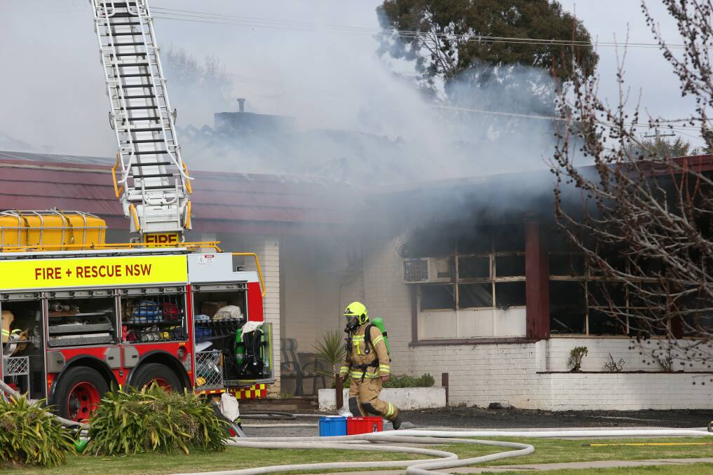 Firefighters at the scene of the ex-motel blaze in Lavington on Monday. Picture by Mark Jesser