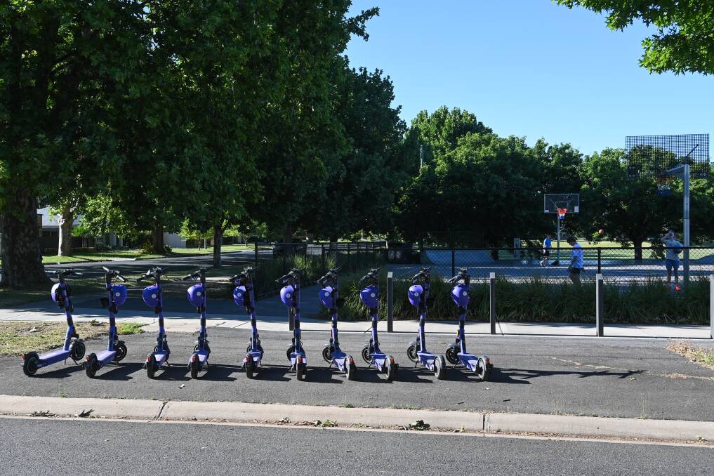 A row of e-scooters are set up in South Albury, ready for riders on Friday, December 15, as the 12-month trial begins. Picture by Mark Jesser