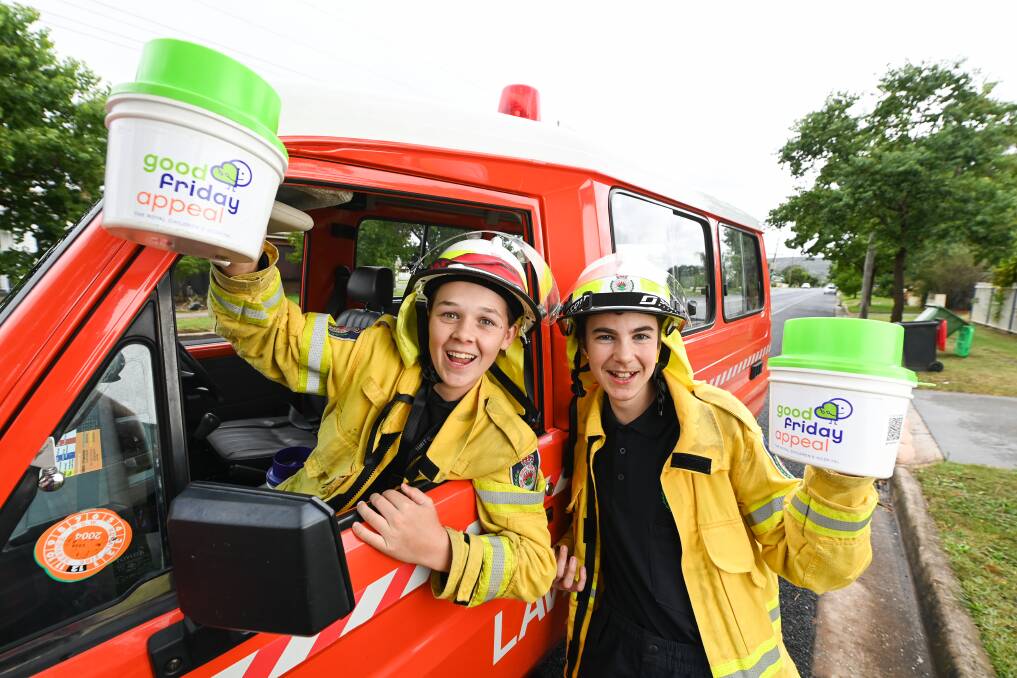 Jett Hurst, 13, and Ben Reid, 14, of the Lavington NSW Rural Fire Service juniors were out and about collecting for the Good Friday Appeal. Picture by Mark Jesser