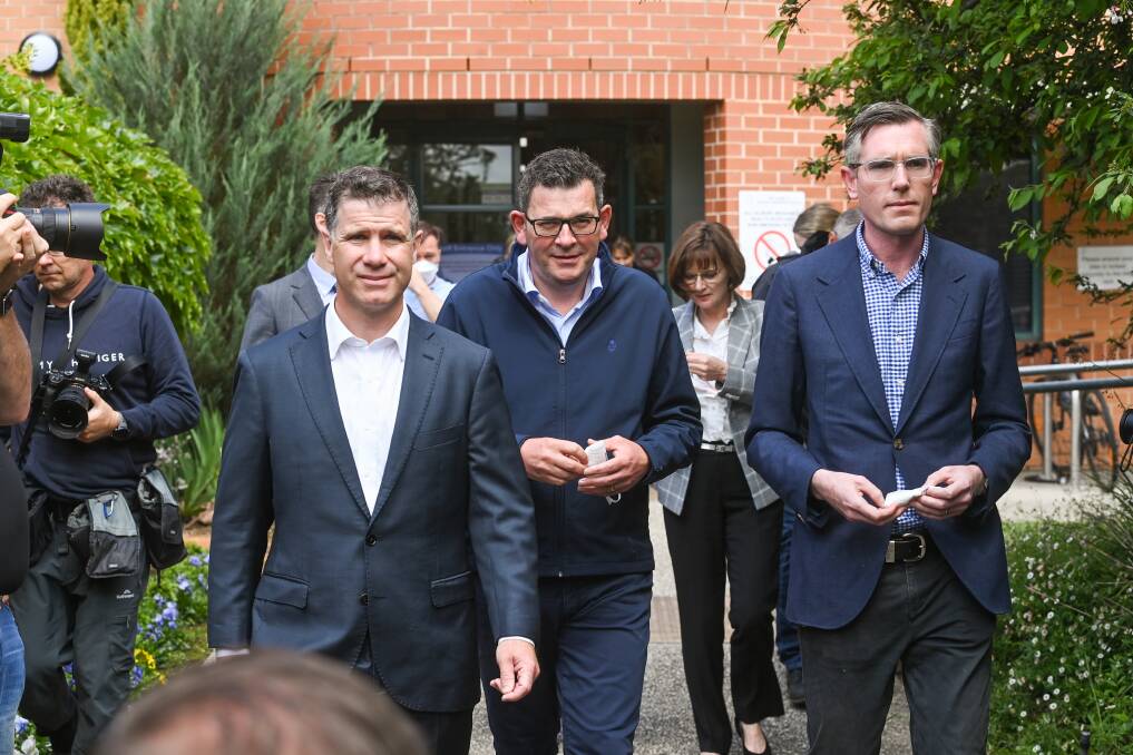 Albury MP Justin Clancy, Victorian Premier Daniel Andrews and his NSW counterpart Dominic Perrottet walk out to announce $558 million of funding to upgrade Albury hospital. Picture by Mark Jesser