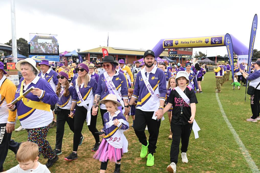 Teams of family, friends and colleagues circle the track during the 2022 Border Relay For Life at Wodonga's Birallee Park. Picture by Mark Jesser