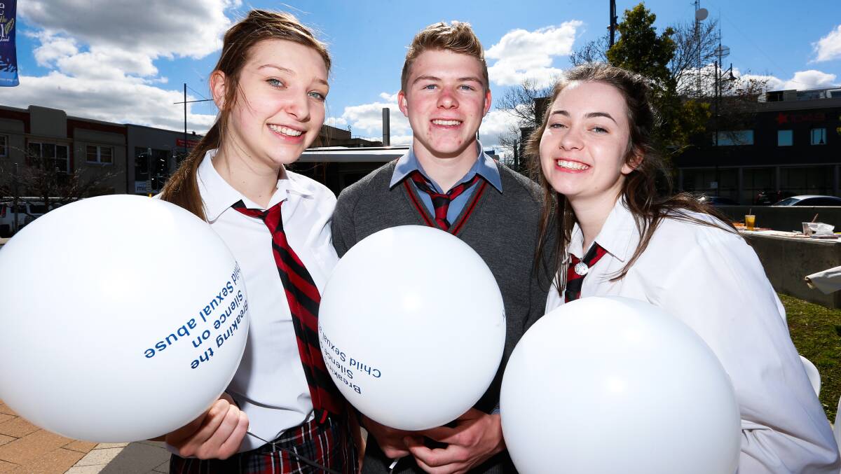 RAISING AWARENESS: Albury High School year 10 students Zoe Butterworth, 16, Joe Cass, 16, and Hannah O'Donnell, 15, take part in Albury's Fly A White Balloon activities. Picture: MARK JESSER