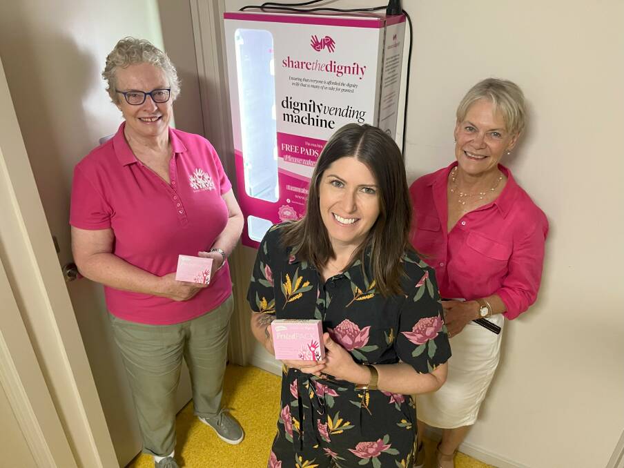 Share the Dignity volunteers Janice Frey and Meredith Mackenzie join Albury councillor Ashley Edwards (centre) in welcoming the installation of dignity vending machines. Picture supplied