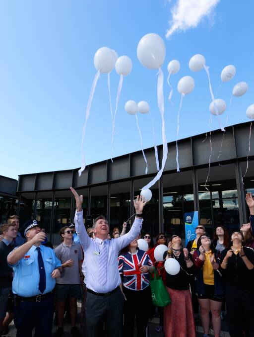GET THE MESSAGE: Albury Mayor Kevin Mack leads the release of balloons in front of Albury Library Museum as part of Fly A White Balloon. Picture: MARK JESSER