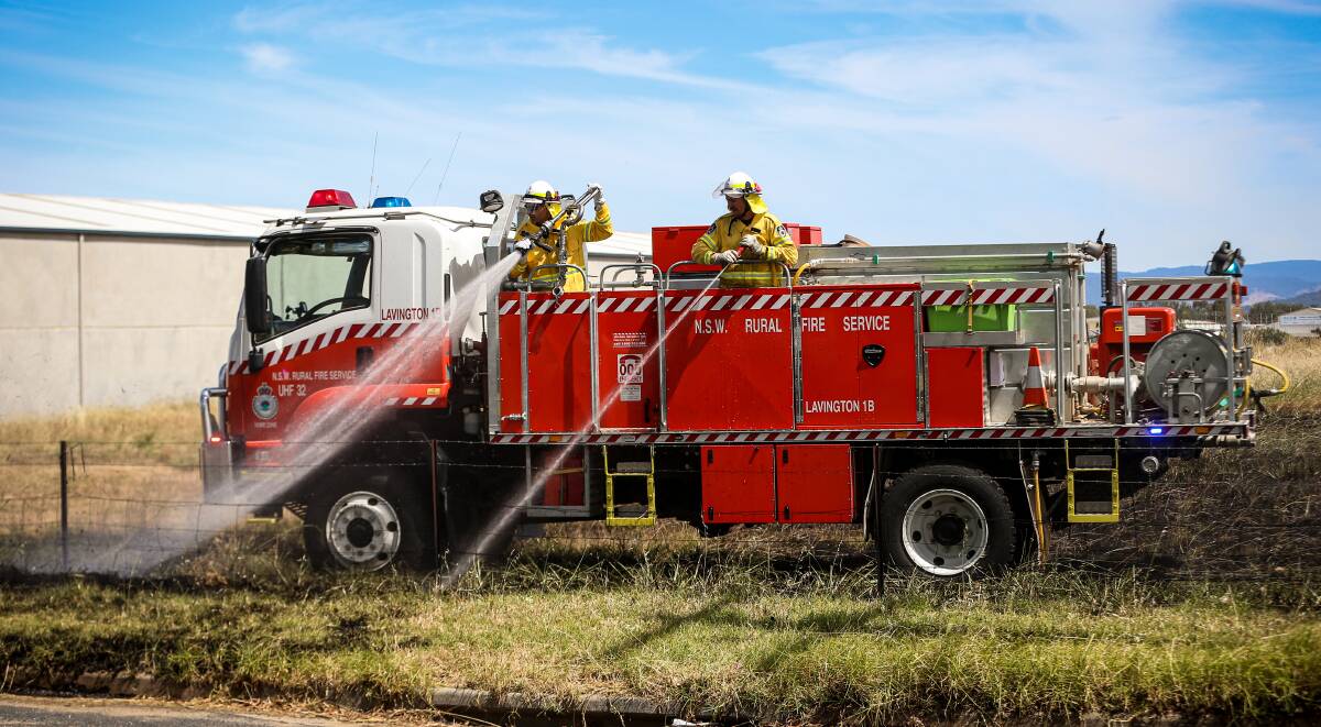 PREVENTION BEST: Firefighters tackle an Albury grass fire last year. The Rural Fire Service warns landowners to take extra care with hay storage and permit burns, given this year's growth. Picture: JAMES WILTSHIRE