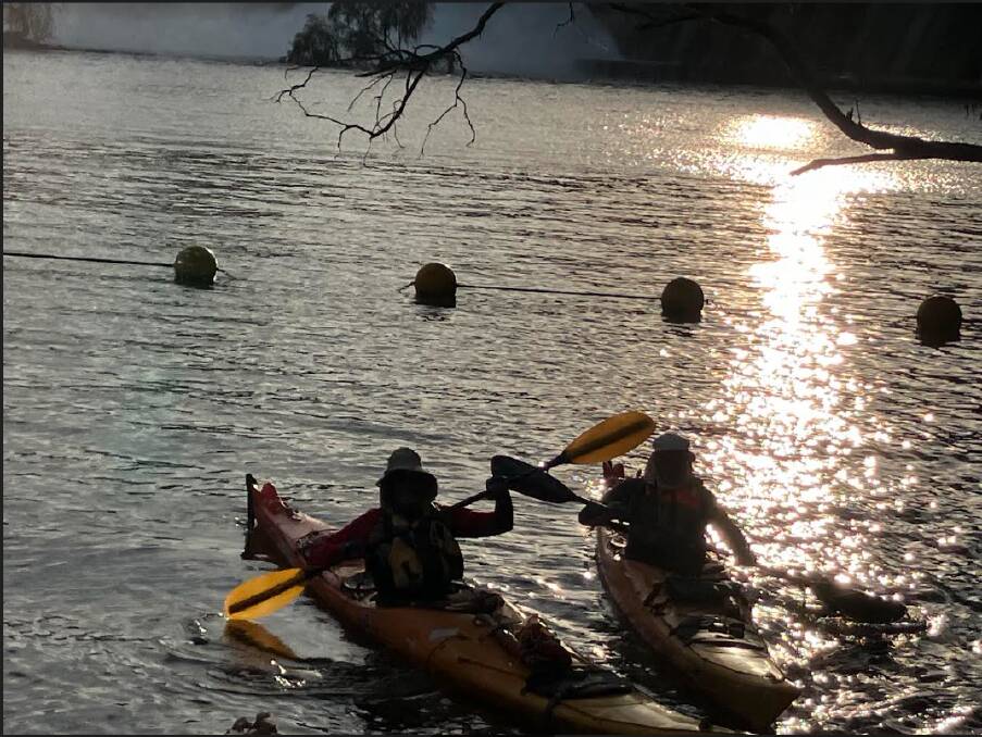 The pair of paddlers made an early start from Lake Hume on Tuesday morning. Picture supplied