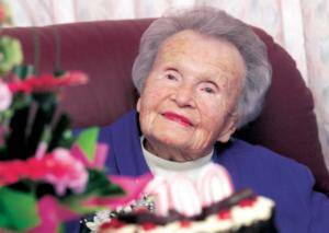 Family and friends helped Lorna Willans celebrate her 100th birthday yesterday, with a slice of cake and sip of champagne. Picture: RAY HUNT