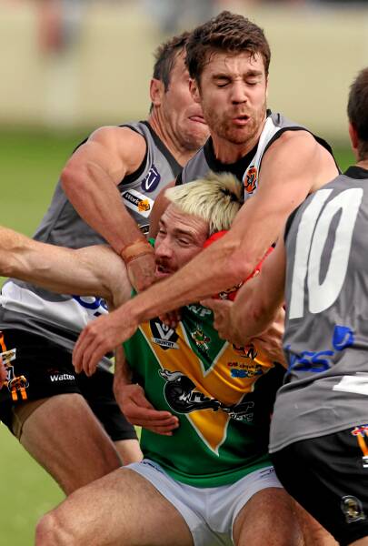 Hoppers coach Jason Akermanis is crunched yesterday. Picture: MATTHEW SMITHWICK