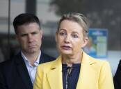 Sussan Ley pictured with Justin Clancy looking over her shoulder at her 2022 election campaign launch. In the weeks before she been sounding out support for Albury Wodonga Health from her Health Minister colleague Greg Hunt. 