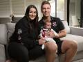 Wodonga Saints coach Zack Pleming with wife Sloan and baby Colton, 6 weeks, ahead of his 100-match milestone on the weekend. Picture by James Wiltshire