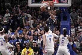 P.J. Washington dunks as he topped the scoring for Dallas in their game 3 win over Oklahoma City. (AP PHOTO)
